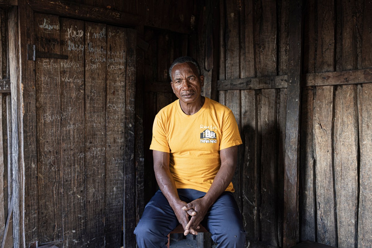 Mbola Jeannot, 57, poses for a portrait inside his home in Ambinanibe in Fort-Dauphin, Madagascar, , on July 12, 2023. He used to own land where the QMM port is now located.