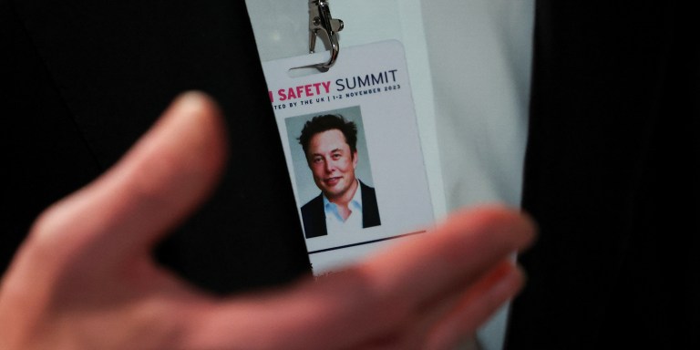 BLETCHLEY, ENGLAND - NOVEMBER 1: Elon Musk, CEO of Tesla and X gestures as he attends the AI Safety Summit in Bletchley Park, on November 1, 2023 in Bletchley, England. The UK Government are hosting the AI Safety Summit bringing together international governments, leading AI companies, civil society groups and experts in research to consider the risks of AI, especially at the frontier of development, and discuss how they can be mitigated through internationally coordinated action. (Photo by Toby Melville - Pool/Getty Images)