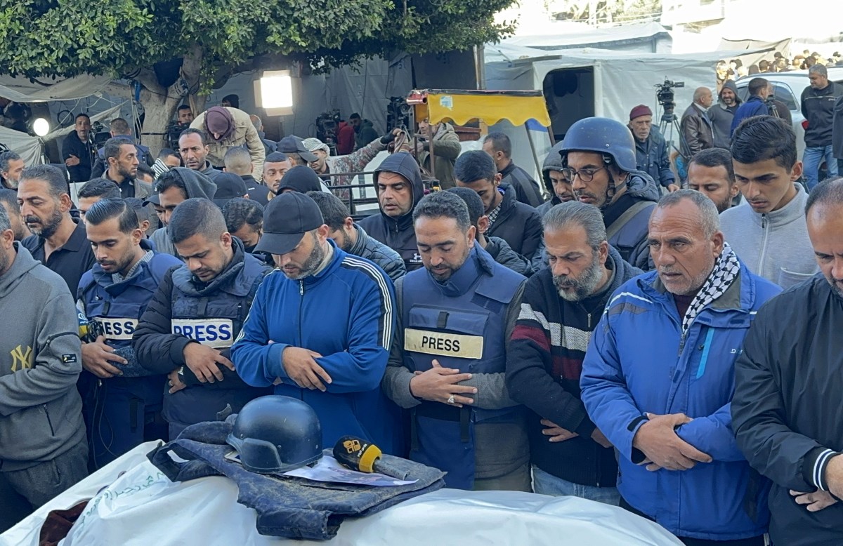 DEIR AL-BALAH, GAZA - DECEMBER 30: Relatives, colleagues and loved ones of Al-Quds TV journalist Cebr Abu Hedrus', who died in Israeli attacks on Nuseirat refugee camp, attend the funeral ceremony in Deir al-Balah, Gaza on December 30, 2023. The Israeli army has killed 106 Palestinian journalists in the Gaza Strip in 84 days of continued intense attacks. (Photo by Doaa Albaz/Anadolu via Getty Images)