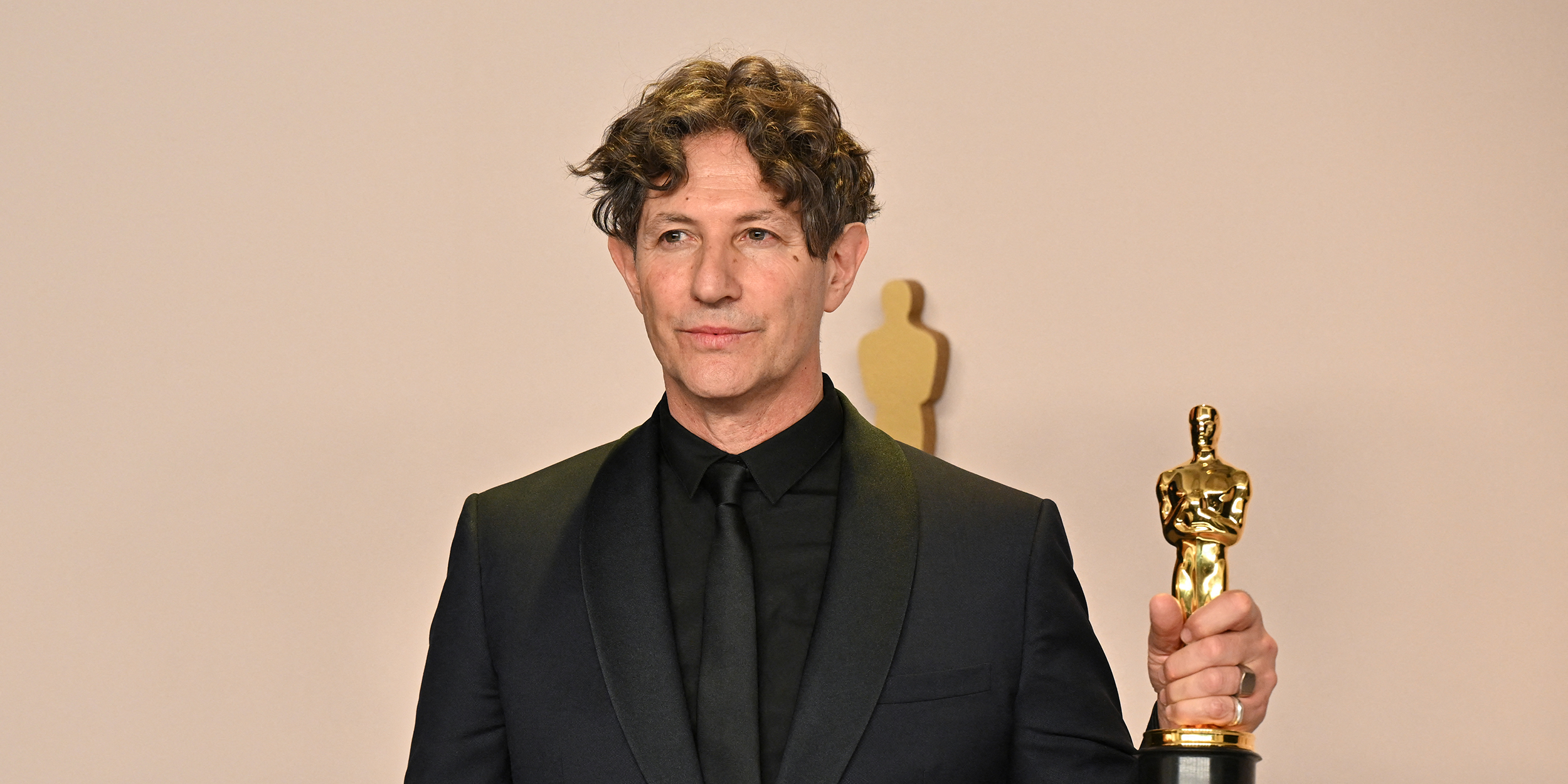 TOPSHOT - English director Jonathan Glazer poses in the press room with the Oscar for Best International Feature Film for "The Zone of Interest" during the 96th Annual Academy Awards at the Dolby Theatre in Hollywood, California on March 10, 2024. (Photo by Robyn BECK / AFP) (Photo by ROBYN BECK/AFP via Getty Images)