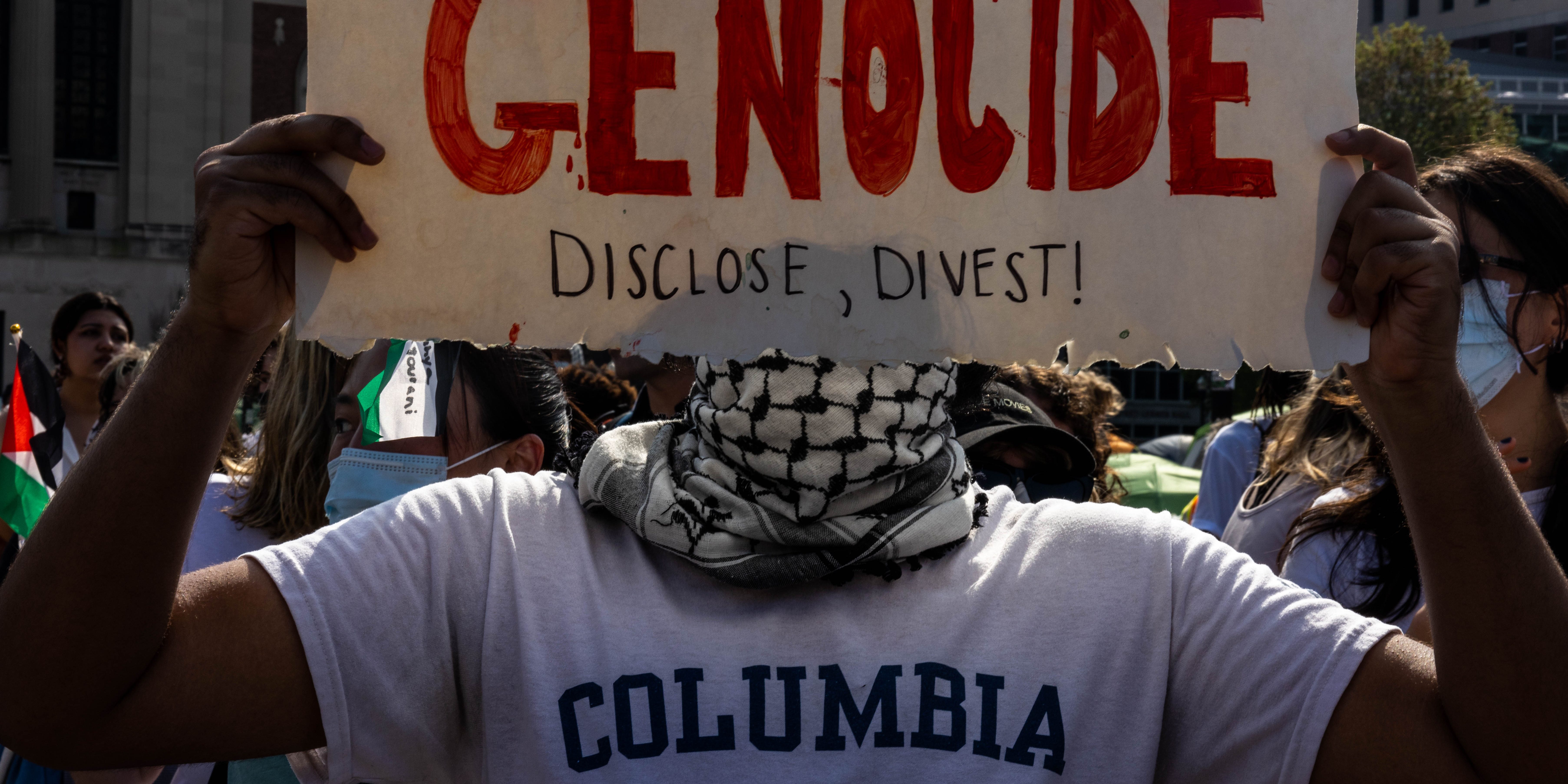 NEW YORK, NEW YORK - APRIL 29: A demonstrator protests outside the encampment established in support of Palestinians in Gaza at Columbia University on April 29, 2024 in New York City. Pro-Palestinian demonstrators marched as a 2 p.m. deadline to clear the encampment given to students by the university came and went. The students were given a suspension warning if they did not meet the deadline. Students at Columbia were the first from an elite college to erect an encampment, demanding that the school divest from Israel amid the Israel-Hamas war, in which more than 34,000 Palestinians have been killed in the Gaza Strip.  (Photo by Alex Kent/Getty Images) This happened hours after protestors were told to voluntarily disperse from the area or face suspensions.