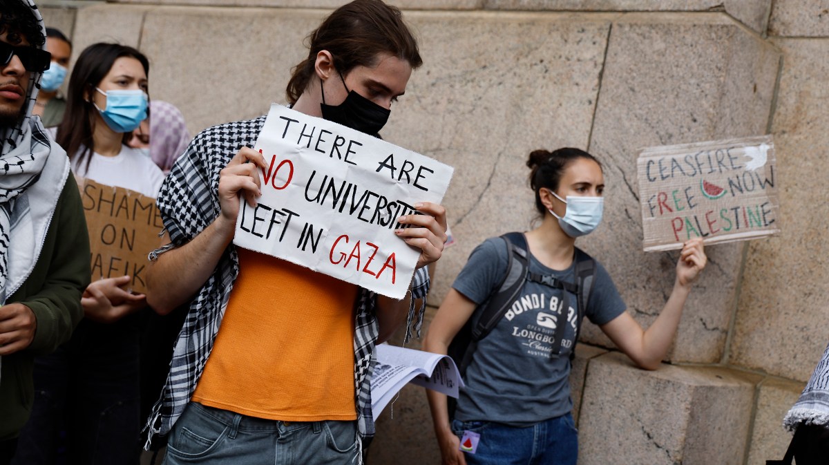 NEW YORK, NEW YORK - MAY 23: People with signs demonstrate near Columbia University on May 23, 2024 in New York City. Demonstrators gathered to protest against New York Mayor Eric Adams’s association with wealthy business owners and investors calling for they city's student protest encampments to be disbanded. Several of New York's prominent business owners reportedly offered political donations to Mayor Adams in an effort to influence public opinion towards Israel, while others suggested payments for private investigators to aid the NYPD in handling the student protesters, according to a Washington Post investigation of conversations made via on-line chats. According to City Hall, the NYPD did not use any donations in their handling of the protesters. (Photo by John Lamparski/Getty Images)