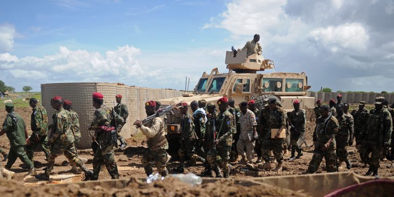 Somali soldiers enter Sanguuni military base, where an American special operations soldier was killed by a mortar attack on June 8, about 450 km south of Mogadishu, Somalia, on June 13, 2018. - More than 500 American forces are partnering with African Union Mission to Somalia (AMISOM) and Somali national security forces in counterterrorism operations, and have conducted frequent raids and drone strikes on Al-Shabaab training camps throughout Somalia. (Photo by Mohamed ABDIWAHAB / AFP)        (Photo credit should read MOHAMED ABDIWAHAB/AFP via Getty Images)