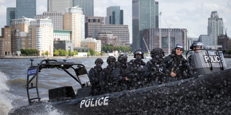 Armed Metropolitan Police counter terrorism officers take part in an exercise on the River Thames in London, Wednesday Aug. 3, 2016. London's police force is putting more armed officers on the streets 'to protect against the threat of terrorism.'' The increase in the number of officers follows attacks in France, Belgium and Germany.  (Stefan Rousseau/Pool Photo via AP)